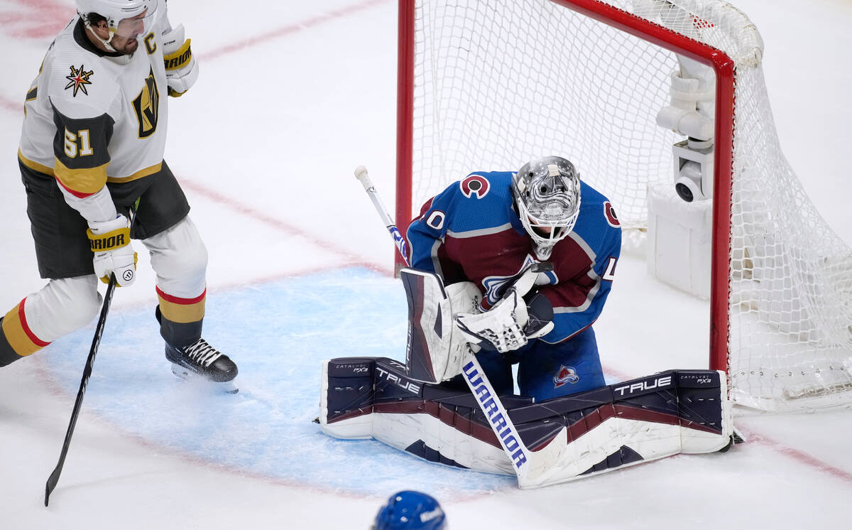 Colorado Avalanche goaltender Alexandar Georgiev, right, stops a shot by Vegas Golden Knights r ...