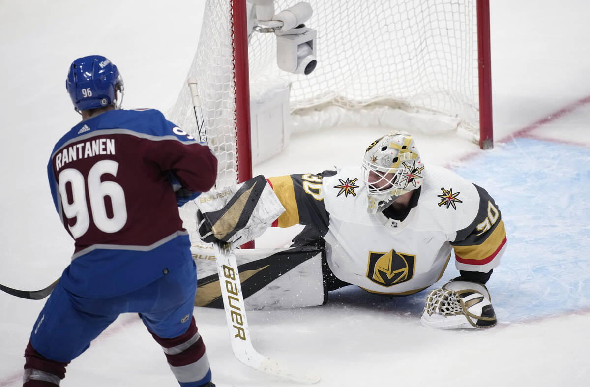 Vegas Golden Knights goaltender Jiri Patera, right, stops a shot by Colorado Avalanche right wi ...