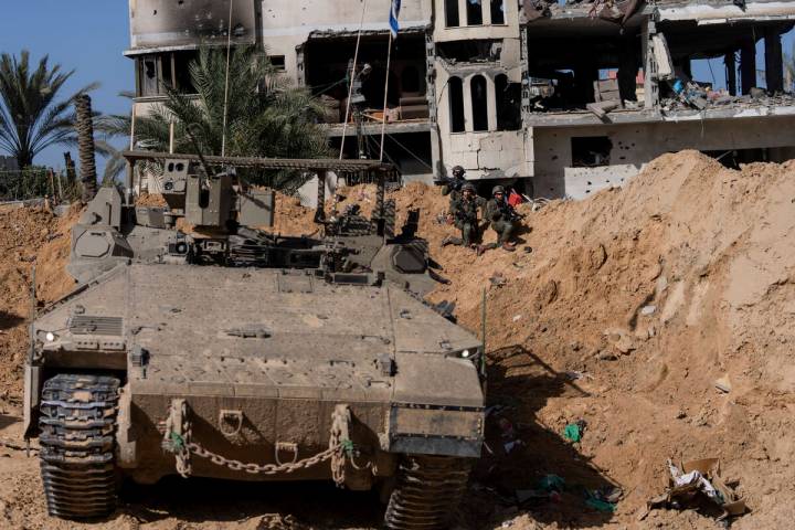 Israeli soldiers take up positions during a ground operation in Khan Younis, Gaza Strip on Wedn ...