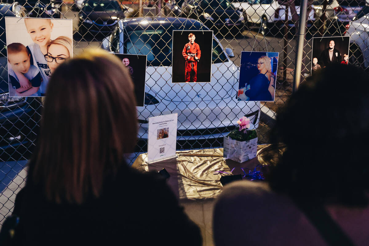 Mourners walk by photographs and posters during a vigil for Rebecca Post, Achilles Quintanilla ...