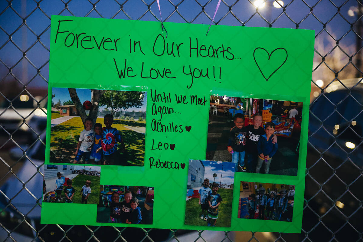 A poster with photographs is strung up on a fence during a vigil for Rebecca Post, Achilles Qui ...