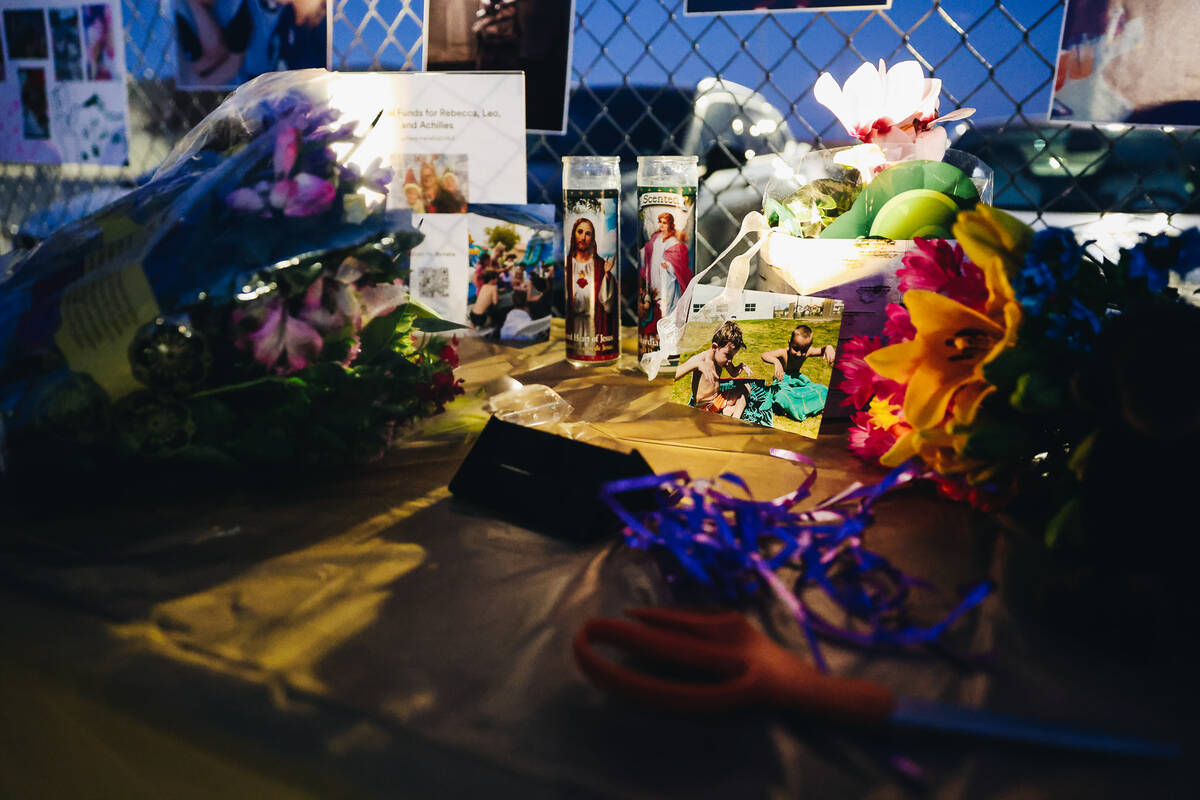 A table filled with photos, candles and flowers is seen during a vigil for Rebecca Post, Achill ...