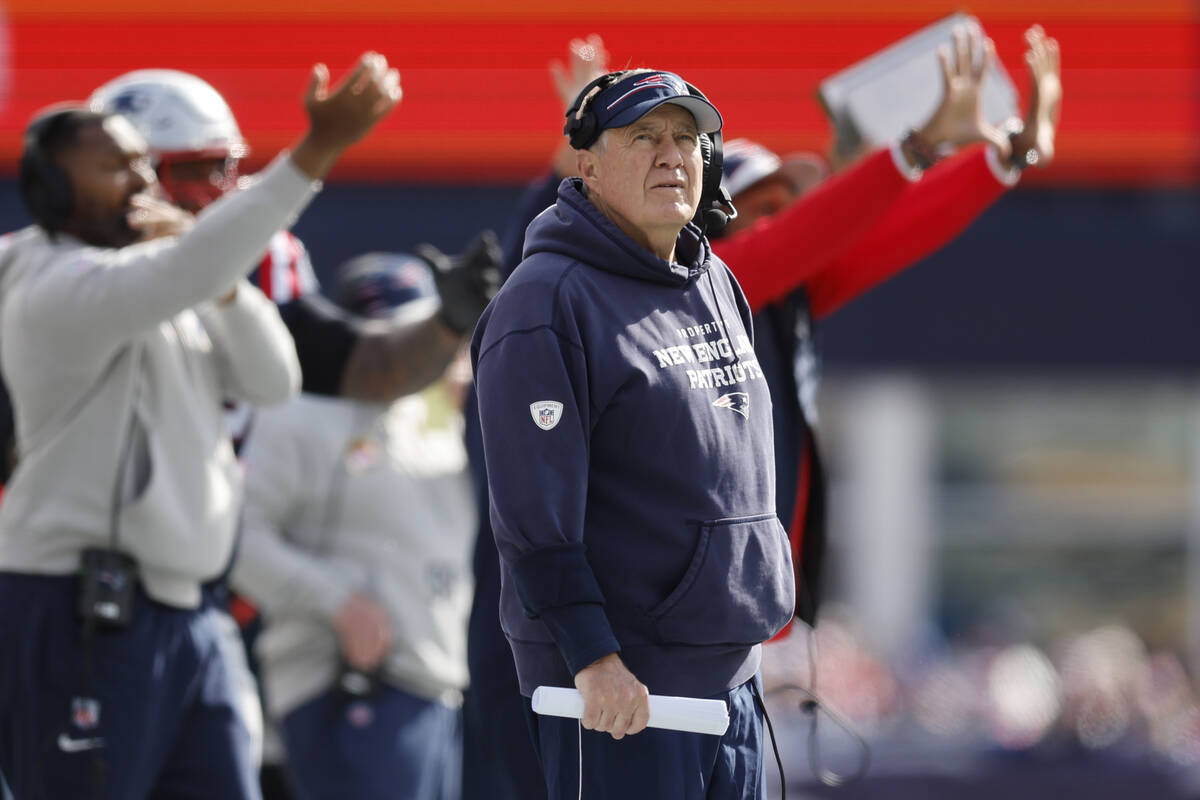 New England Patriots head coach Bill Belichick looks towards the scoreboard during the first ha ...