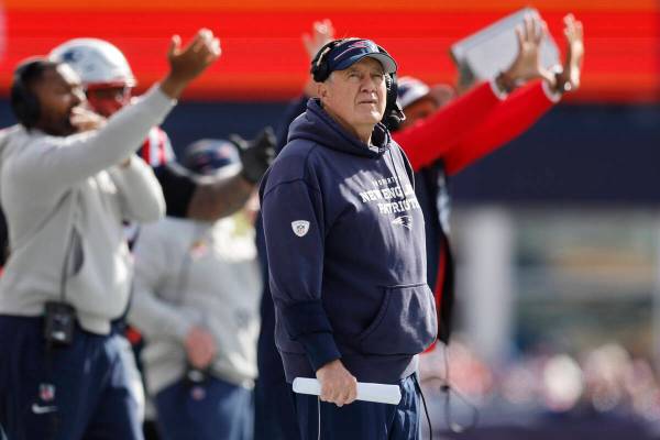 New England Patriots head coach Bill Belichick looks towards the scoreboard during the first ha ...
