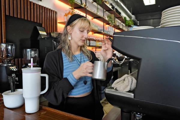 Samantha Grimison makes a cup of coffee at the Blind Tiger Cafe Wednesday, Jan. 10, 2024, in Ta ...