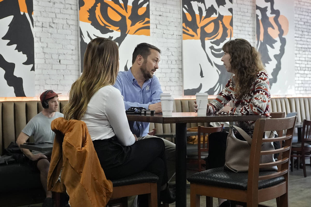Customers drink coffee at the Blind Tiger Cafe Wednesday, Jan. 10, 2024, in Tampa, Fla. (AP Pho ...