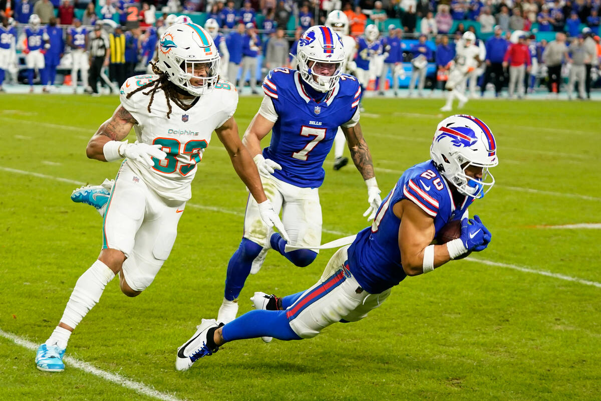 Buffalo Bills safety Taylor Rapp (20) intercepts a pass intended for Miami Dolphins wide receiv ...