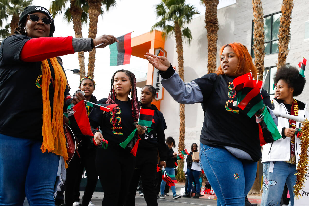 Members of the Black Student Union Network walk in the annual Martin Luther King Jr. Day parade ...