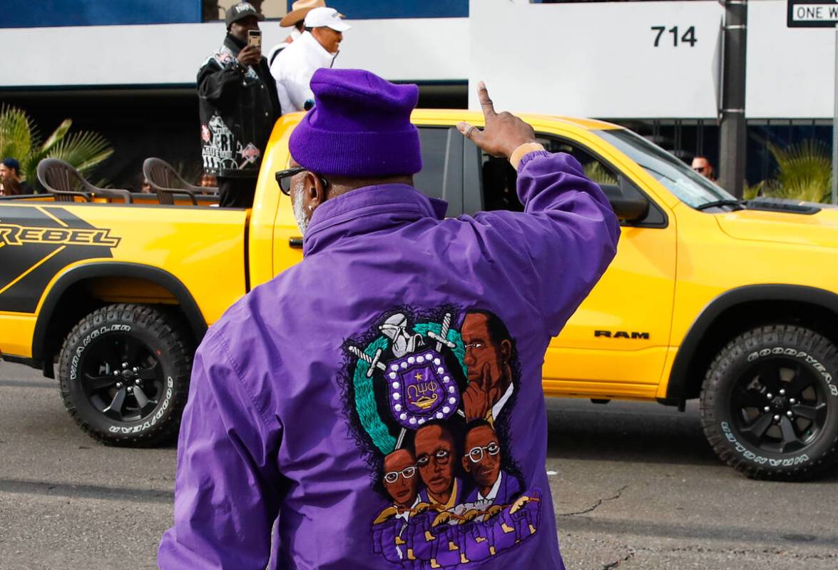 A man cheers on people during the annual Martin Luther King Jr. Day parade on Monday, Jan. 15, ...