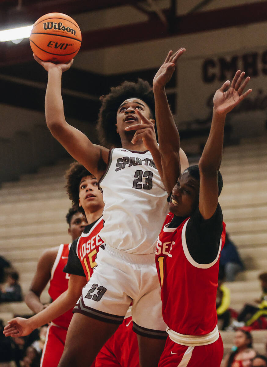 Cimarron-Memorial power forward Gerald Papperson (23) jumps up for a layup during a game agains ...