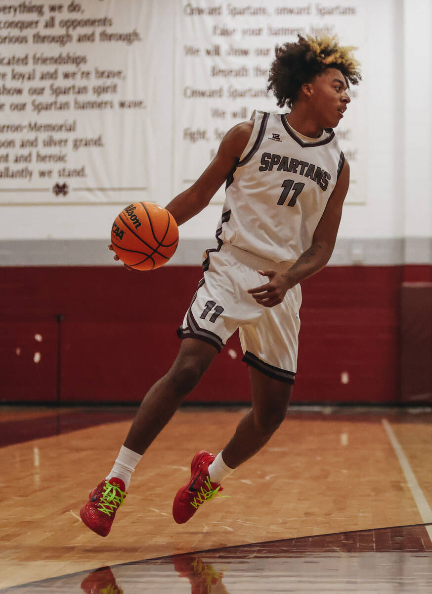 Cimarron-Memorial small forward Geremiah Rone (11) dribbles the ball during a game against Some ...