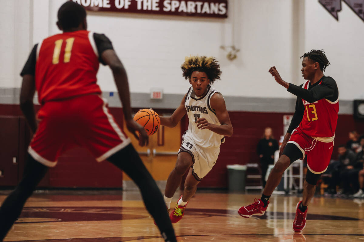 Cimarron-Memorial small forward Geremiah Rone (11) dribbles the ball during a game against Some ...