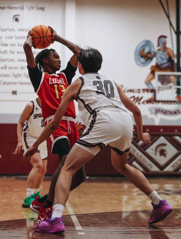 Somerset-Losee guard KeSean White (13) looks to pass the ball to a teammate during a game at Ci ...