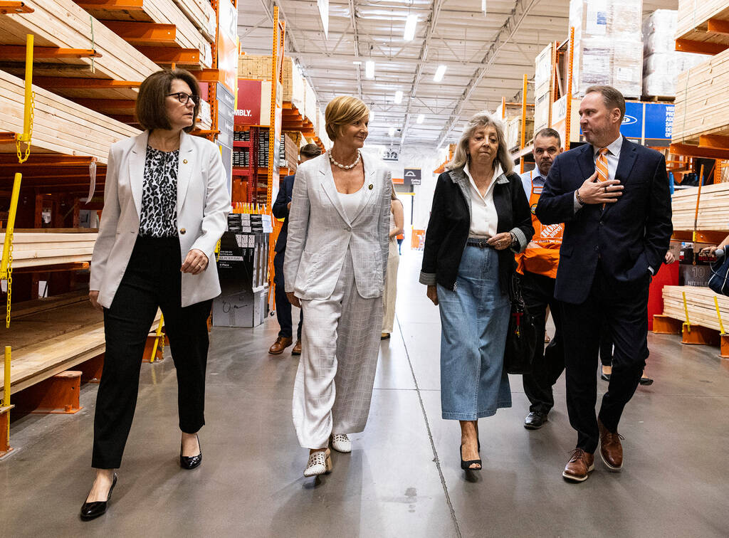 Scott Glenn, vice president of asset protection at the Home Depot, right, leads a tour of the H ...