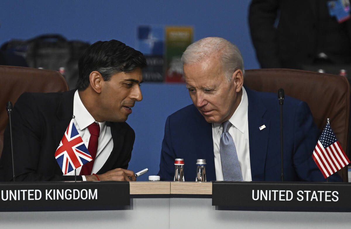 FILE - Britain's Prime Minister Rishi Sunak, left, and U.S. President Joe Biden speak at the st ...