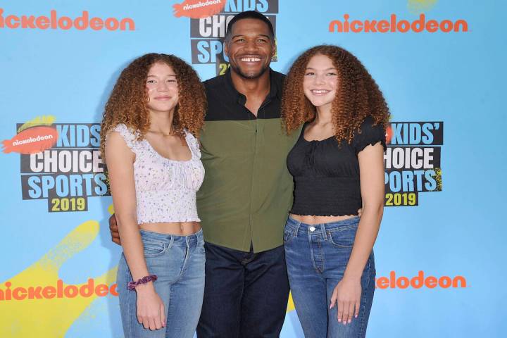 Michael Strahan, center, and his daughters Sophia Strahan, left, and Isabella Strahan arrive at ...