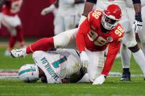 Miami Dolphins quarterback Tua Tagovailoa (1) is sacked for an 11-yard loss by Kansas City Chie ...