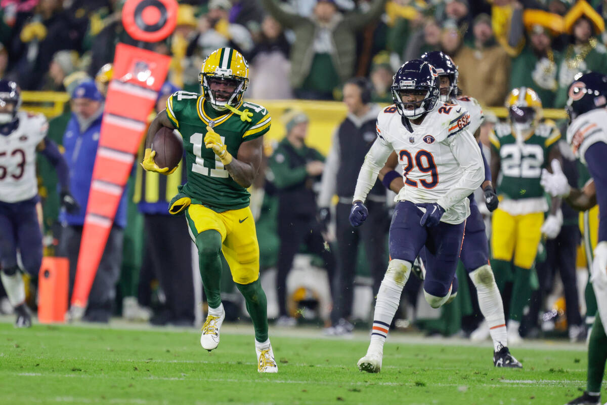 Green Bay Packers wide receiver Jayden Reed (11) runs after making a catch during an NFL footba ...