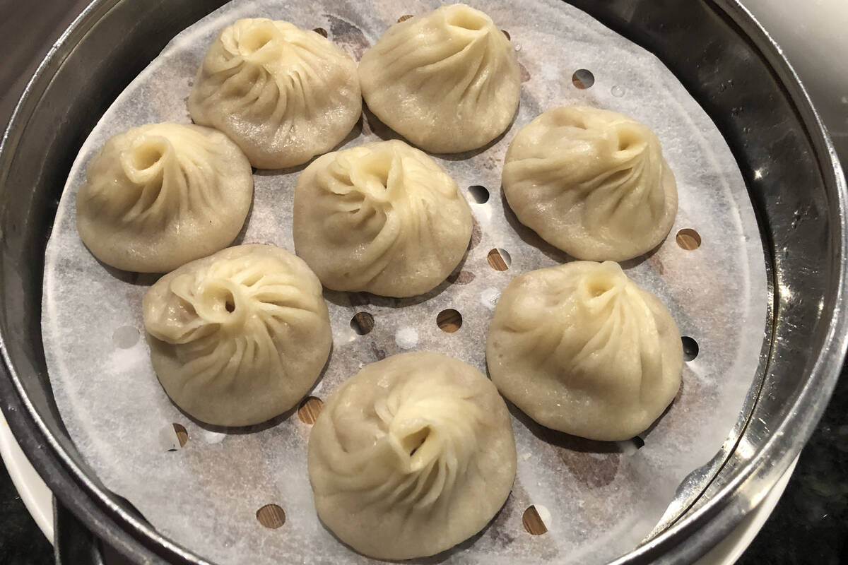 Traditional xiao long bao, often called Shanghai soup dumplings, from ShangHai Taste, which is ...