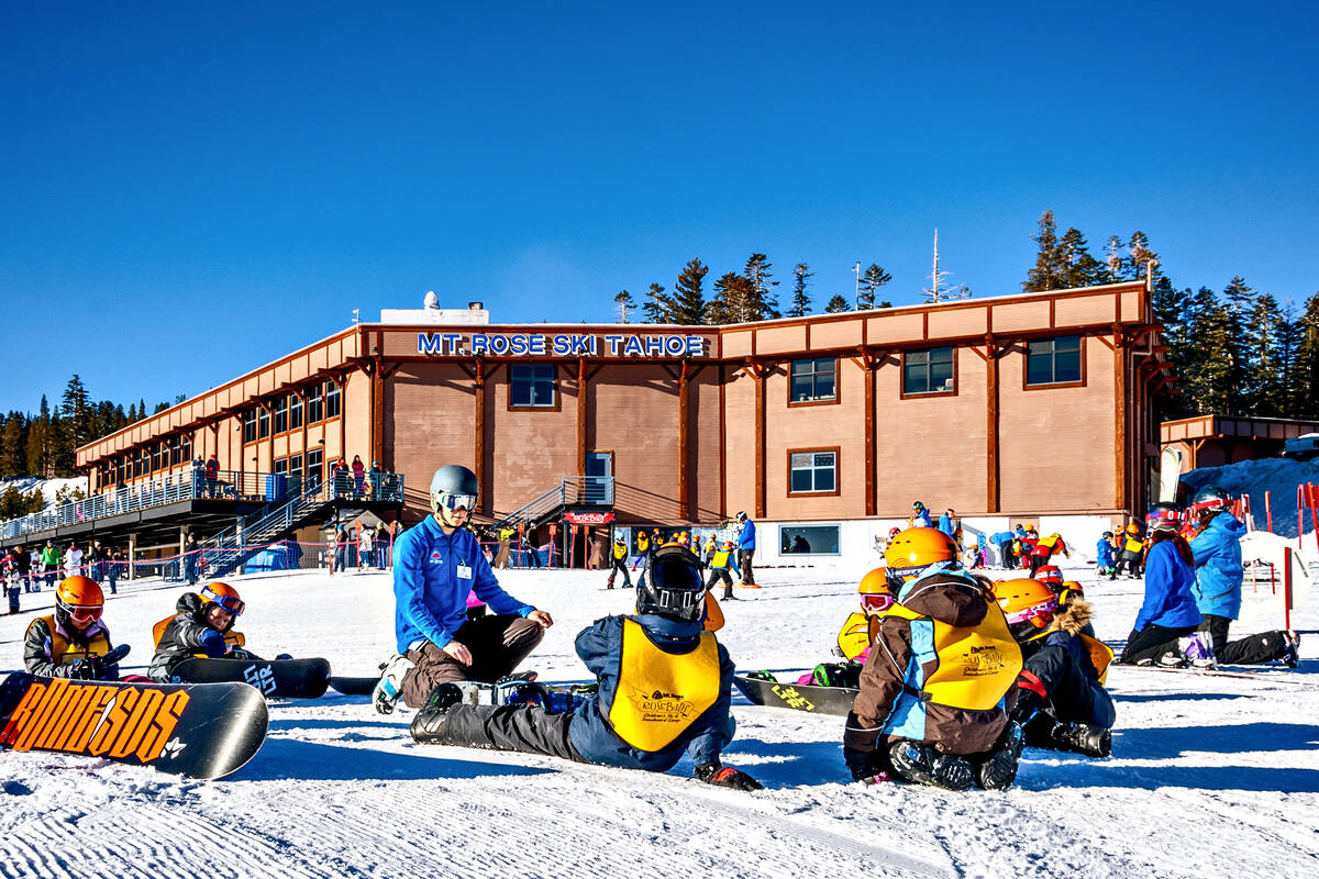 An instructor talks with young guests during a snowboarding lesson at Mount Rose Ski Tahoe. (Ma ...