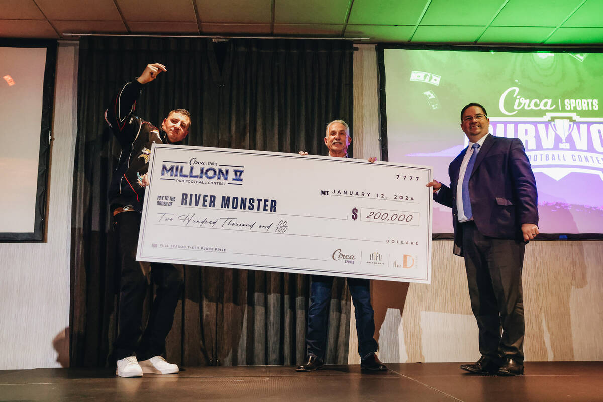 Team River Monster poses with a giant check during an awards ceremony for Circa Survivor contes ...