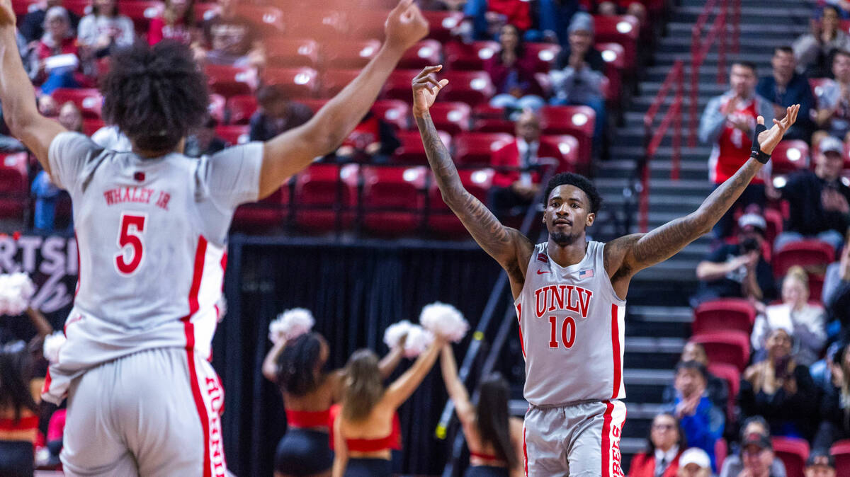 UNLV forward Rob Whaley Jr. (5) and forward Kalib Boone (10) celebrate another score over the U ...