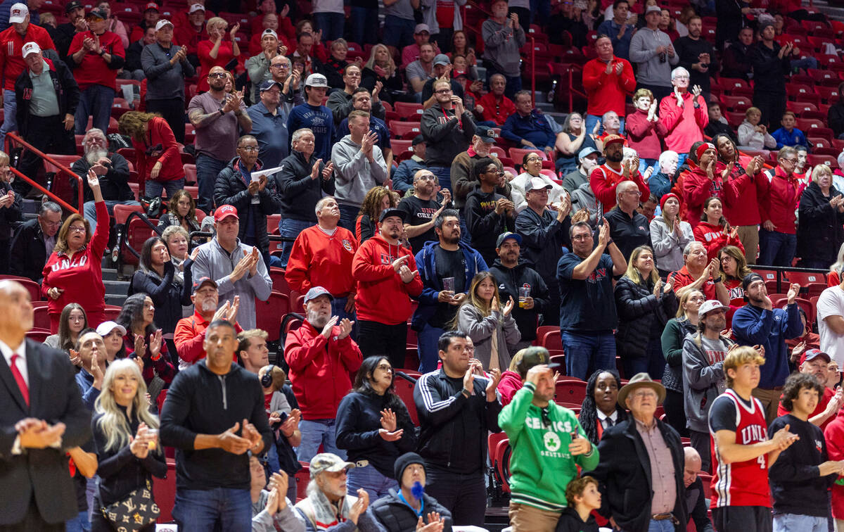 UNLV fans are excited as the team lead the Utah State Aggies during the first half of their NCA ...