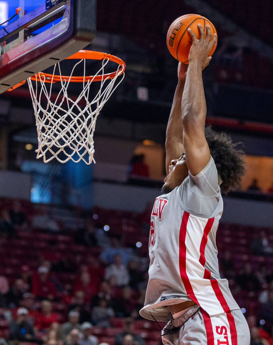 UNLV forward Rob Whaley Jr. (5) sets up to dunk the ball against the Utah State Aggies during t ...