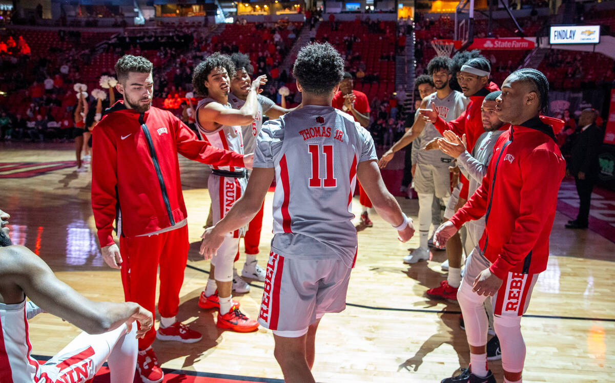 UNLV guard Dedan Thomas Jr. (11) is introduced and welcomed by teammates in pregame activities ...