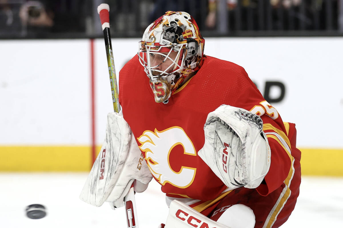 Flames goaltender Jacob Markstrom (25) prepares to save the puck during the first period of an ...