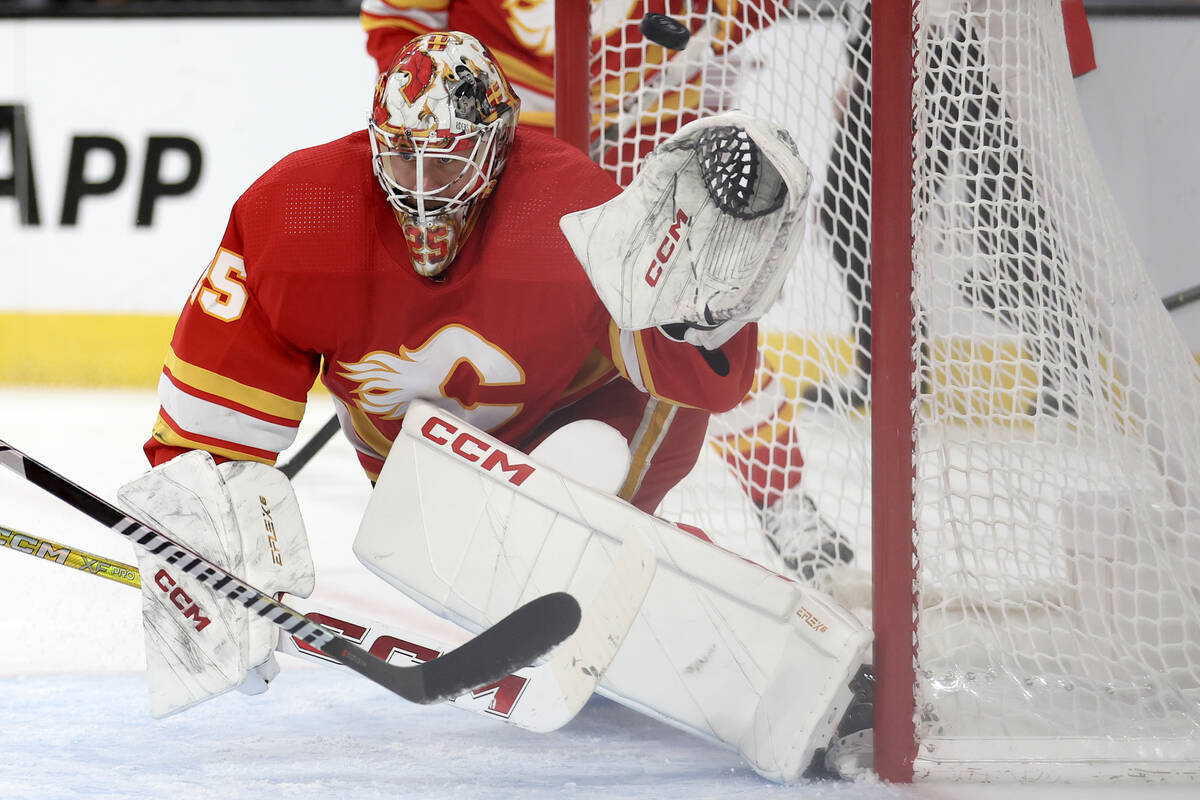 Flames goaltender Jacob Markstrom (25) misses the save on a goal by Golden Knights center Chand ...