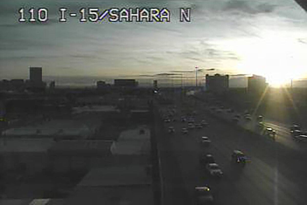 The setting sun shows a mostly clear sky as seen from Interstate 15 at Sahara Avenue about 4:20 ...