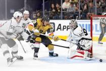 Golden Knights center Brendan Brisson (19) attempts a goal against Kings goaltender Jean-Franc ...