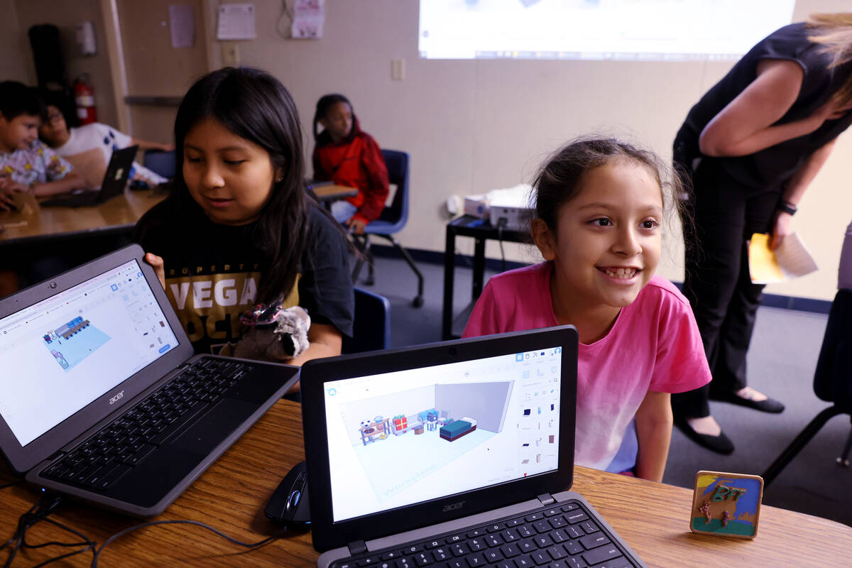 Sofia Martinez, left, and Patricia Hernandez, both 9, show their designs for 3D printing during ...