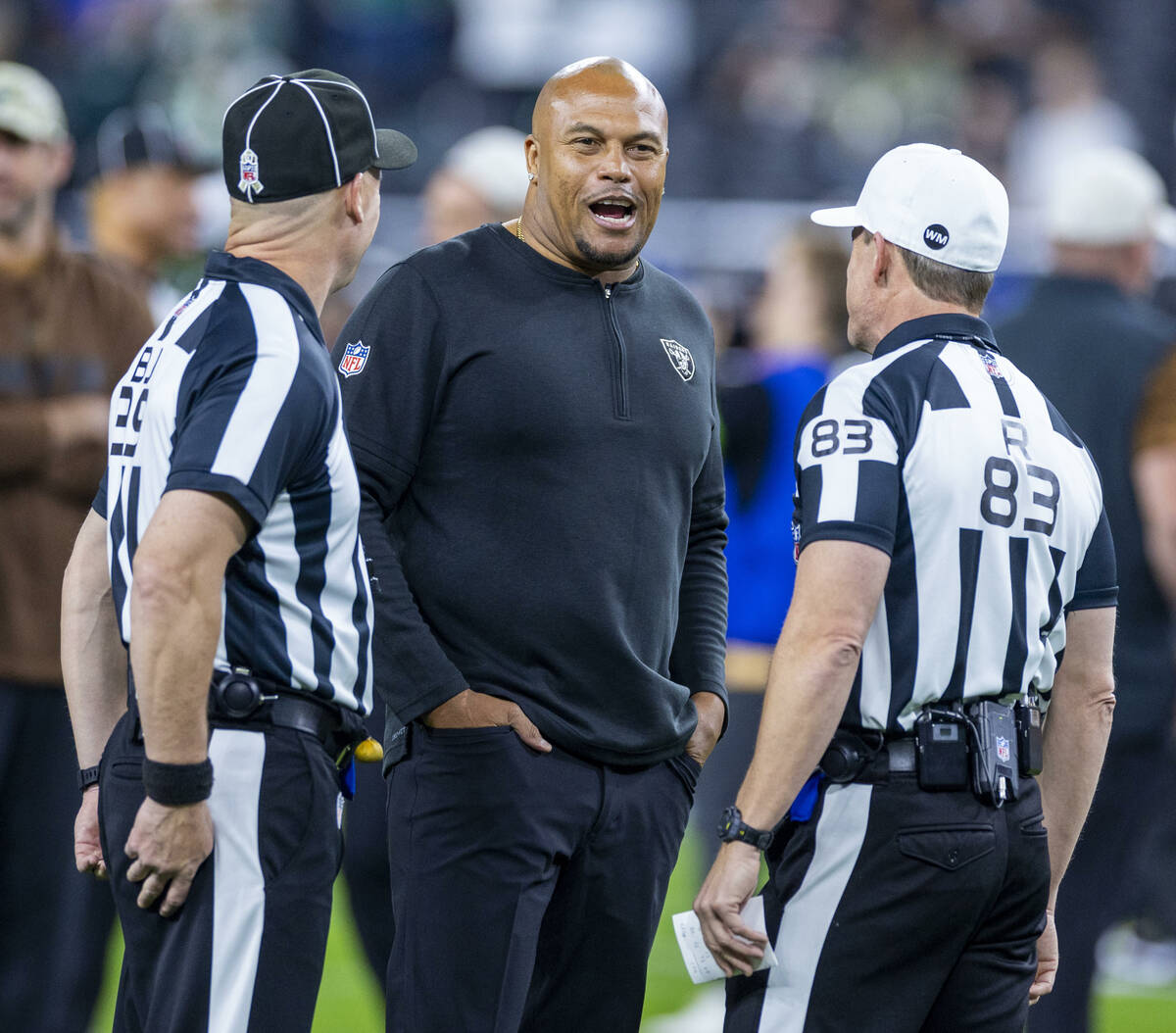 Raiders interim head coach Antonio Pierce talks with officials before the first half of their N ...