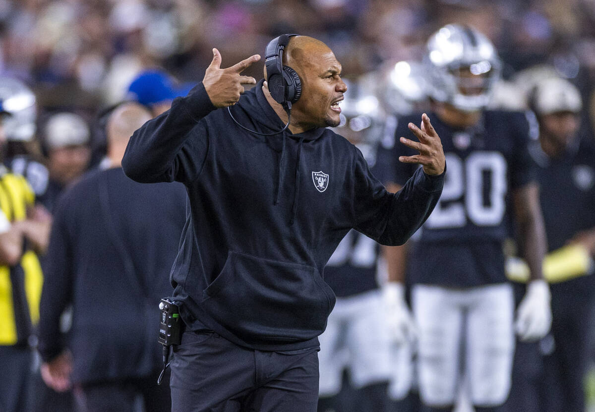 Raiders interim head coach Antonio Pierce yells to his players against the New York Jets during ...