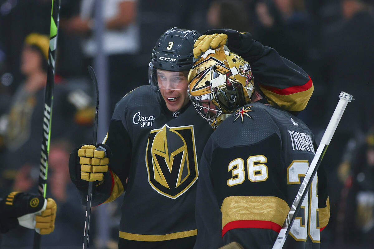 Vegas Golden Knights defenseman Brayden McNabb congratulates goaltender Logan Thompson (36) on ...