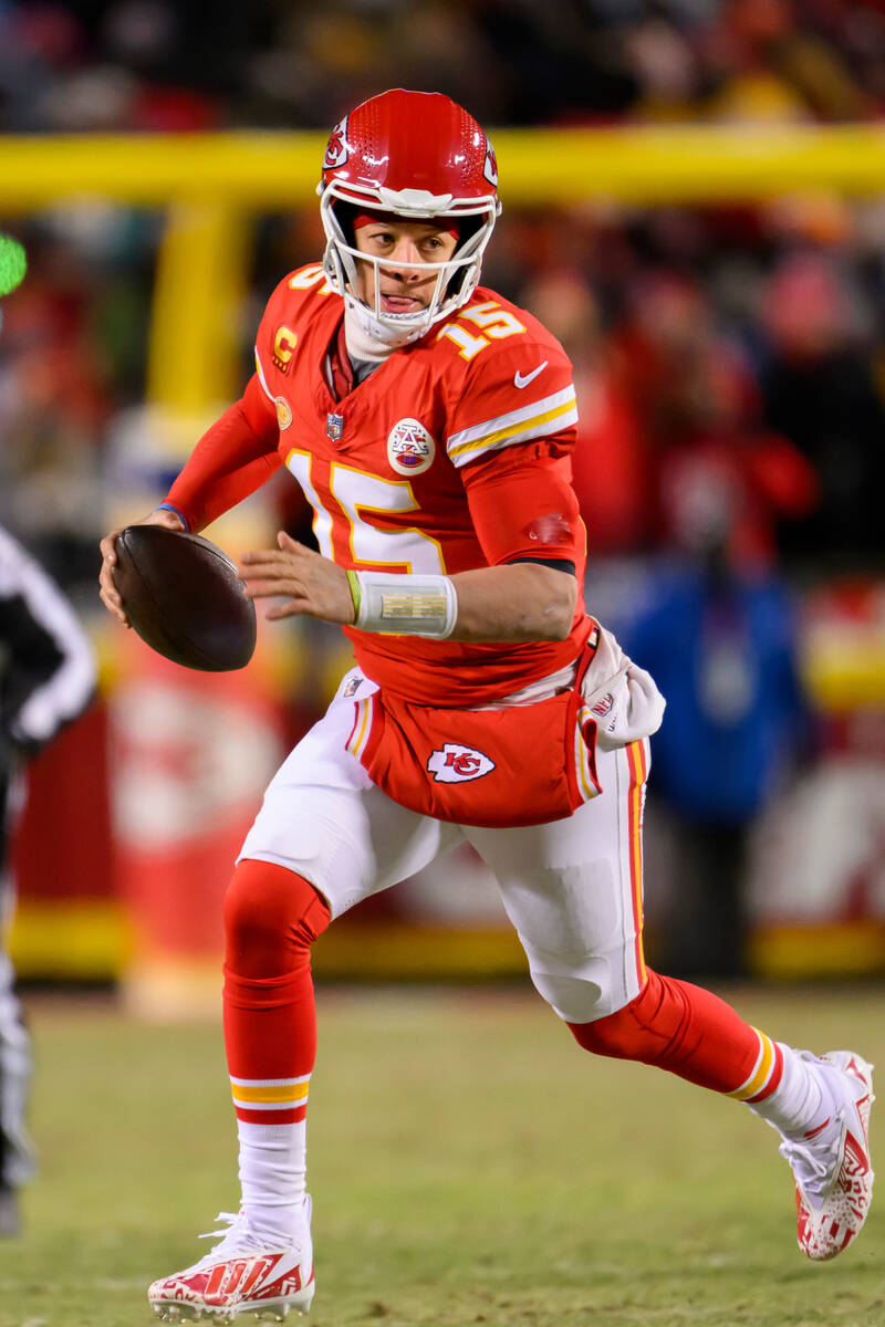 Kansas City Chiefs quarterback Patrick Mahomes escapes Miami Dolphins pressure and runs for a f ...