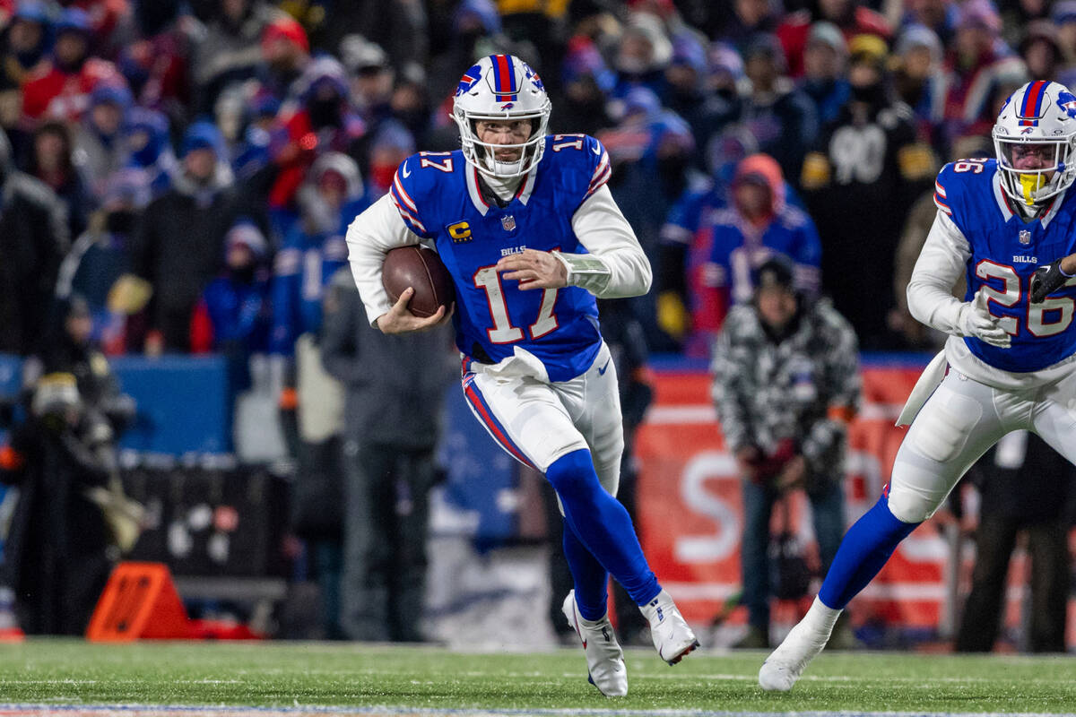 Buffalo Bills quarterback Josh Allen (17) rushes during an NFL wild-card playoff football game, ...