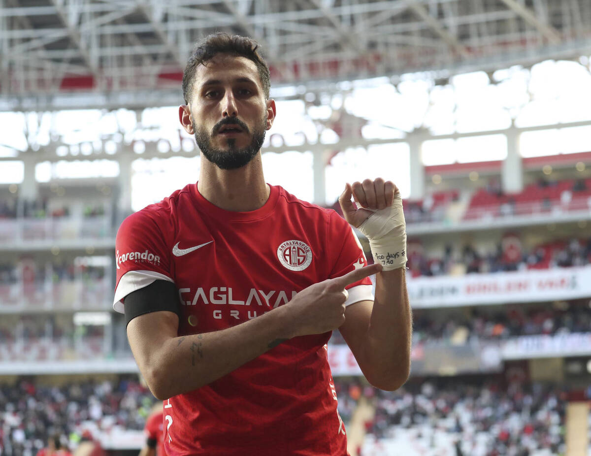 Antalyaspor's Sagiv Jehezkel points a message in his bandage that reads: "100 days. 7.10&q ...