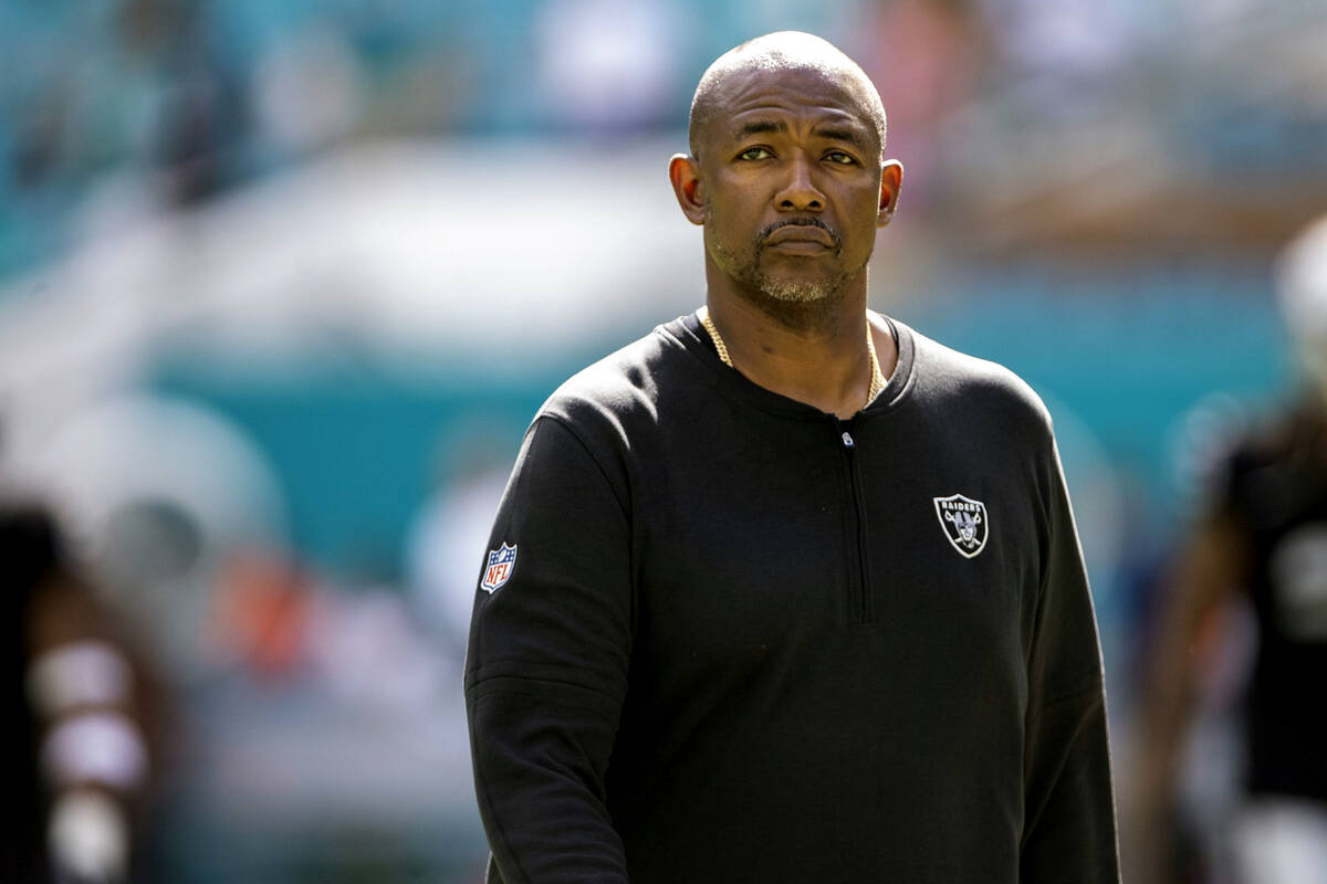 Raiders defensive coordinator Patrick Graham walks on the field before an NFL game against the ...