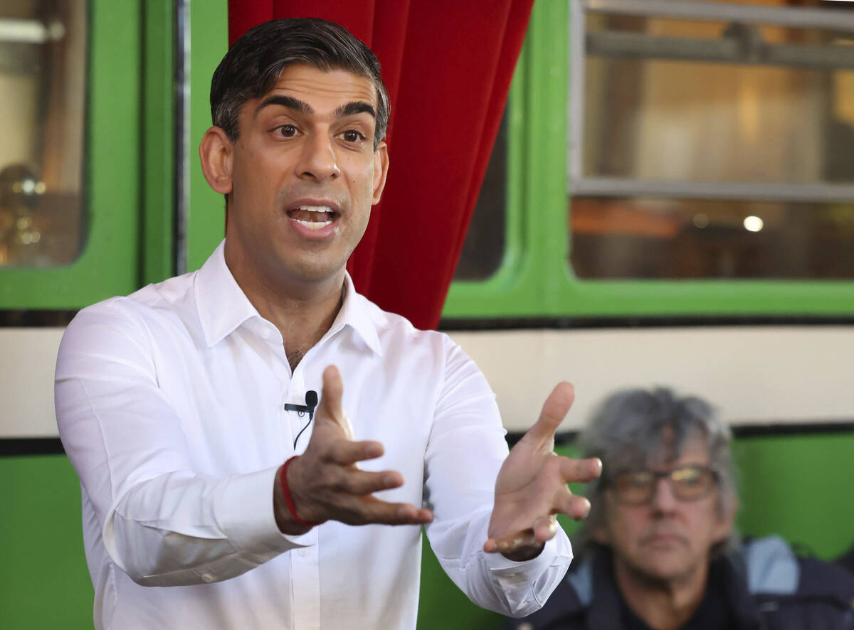 Britain's Prime Minister Rishi Sunak gestures during his visit to The Boatyard in Leigh-on-Sea, ...