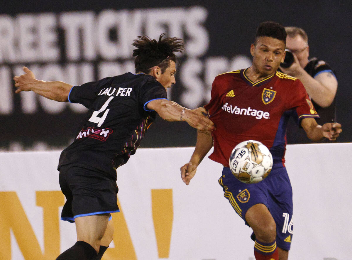 Real Salt Lake midfielder Maikel Chang (16) keeps a ball away from Las Vegas Lights FC defender ...