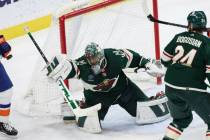 Minnesota Wild goaltender Marc-Andre Fleury defends the net against the New York Islanders duri ...