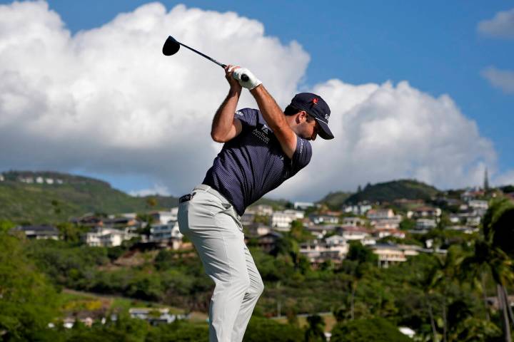 Taylor Montgomery hits from the 14th tee during the first round of the Sony Open in Hawaii, Thu ...