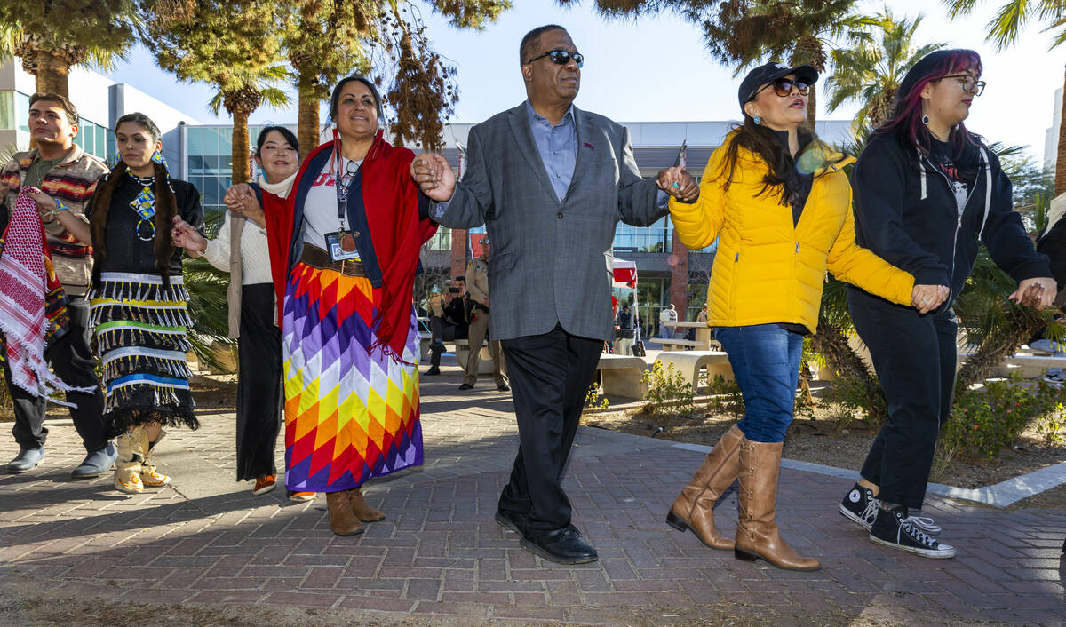 Attendees including UNLV President Keith Whitfield, center, take part in a round dance about th ...