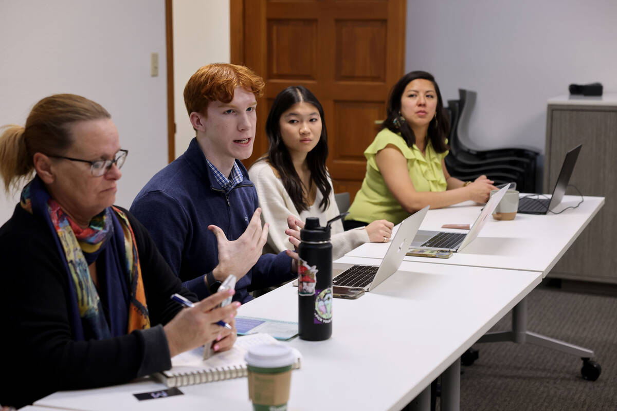 Cooper Cunningham, 18, a senior at Bishop Gorman High School, second from left, speaks during a ...