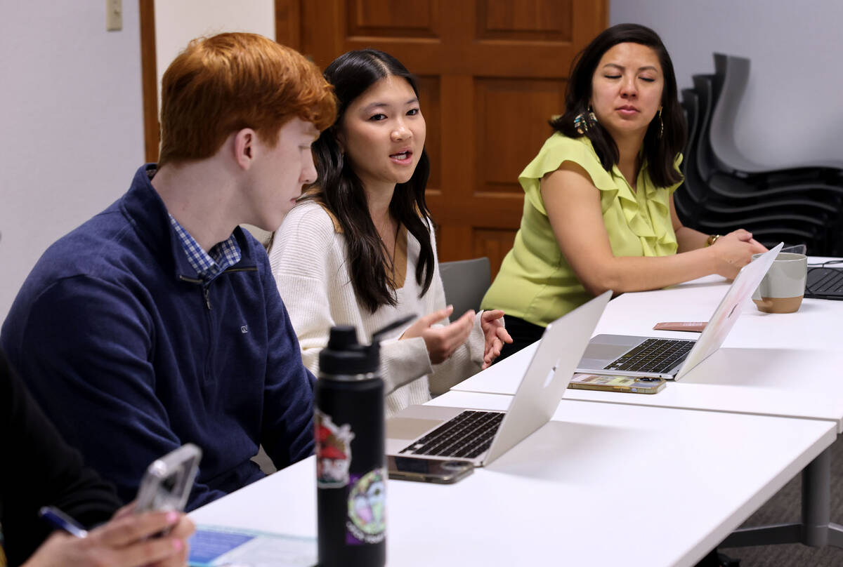 Ella King, 17, a senior at Coronado High School, center, speaks during a youth mental health di ...