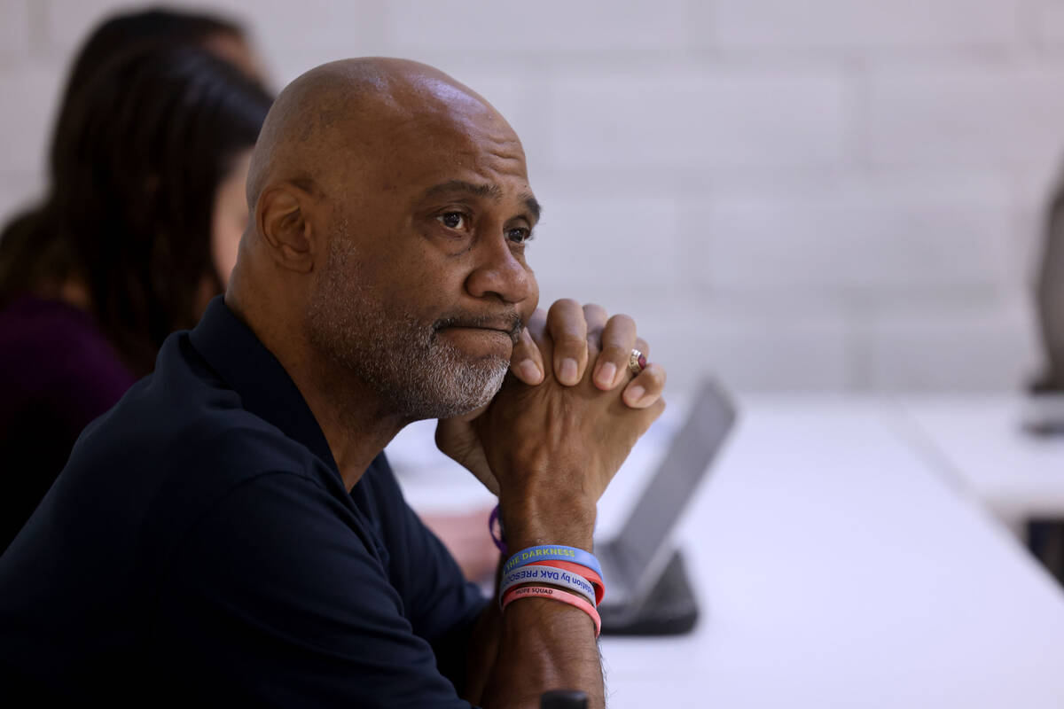 Chris Thomas, CEO and co-founder The Defensive Line, listens during a youth mental health discu ...