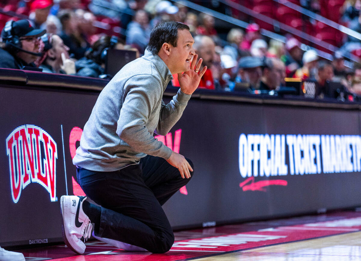 UNLV head coach Kevin Kruger calls a play against the Utah State Aggies during the first half o ...